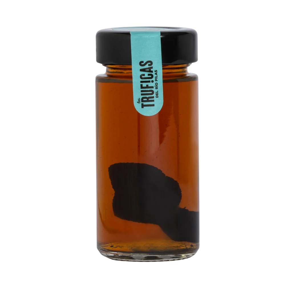Trufa negra con brandy para cocinar Truficas en tarro de cristal con la trufa entera sumergida